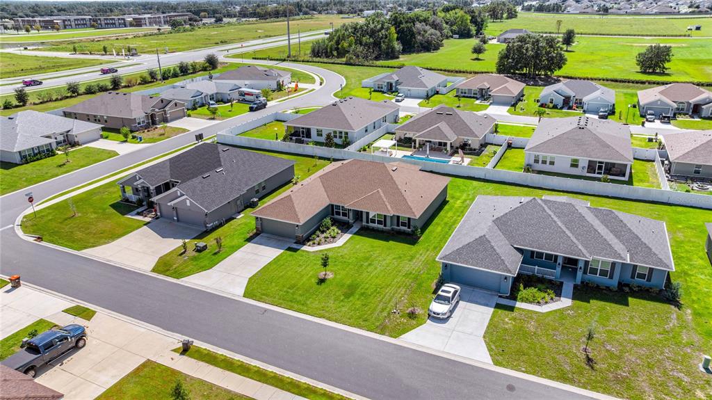 4984 Southwest 91st Place Ocala, FL 34476 - Photo 39 of 42 an aerial view of a house with a garden and lake view