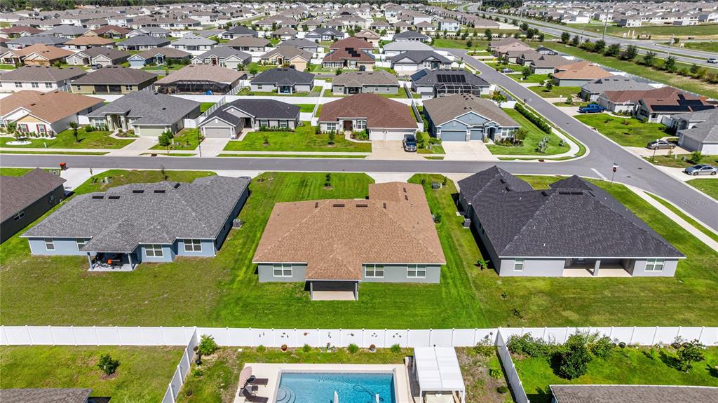 4984 Southwest 91st Place Ocala, FL 34476 - Photo 40 of 42 an aerial view of residential houses with outdoor space