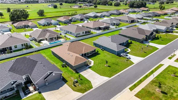 an aerial view of a house with a garden