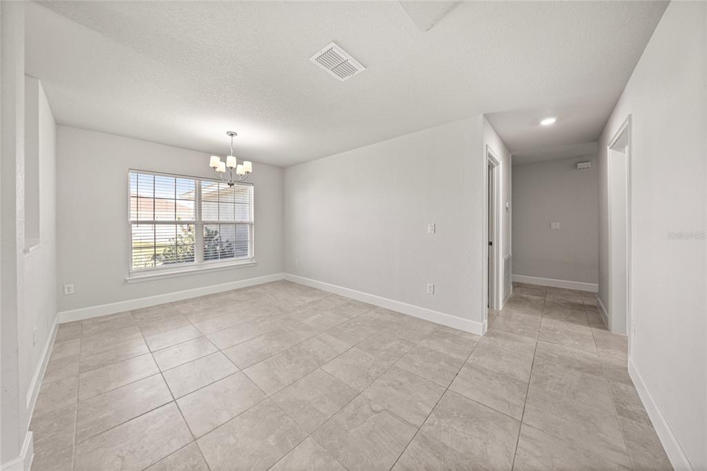 4984 Southwest 91st Place Ocala, FL 34476 - Photo 9 of 42 a view of an empty room with a window