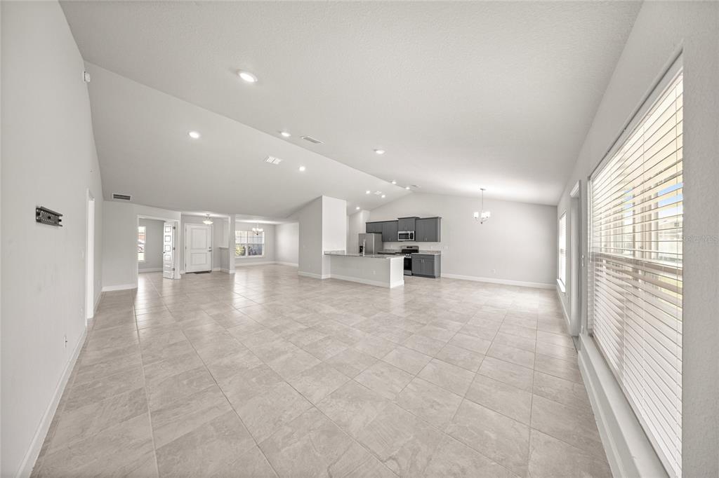4984 Southwest 91st Place Ocala, FL 34476 - Photo 10 of 42 a view of kitchen with kitchen island and a window