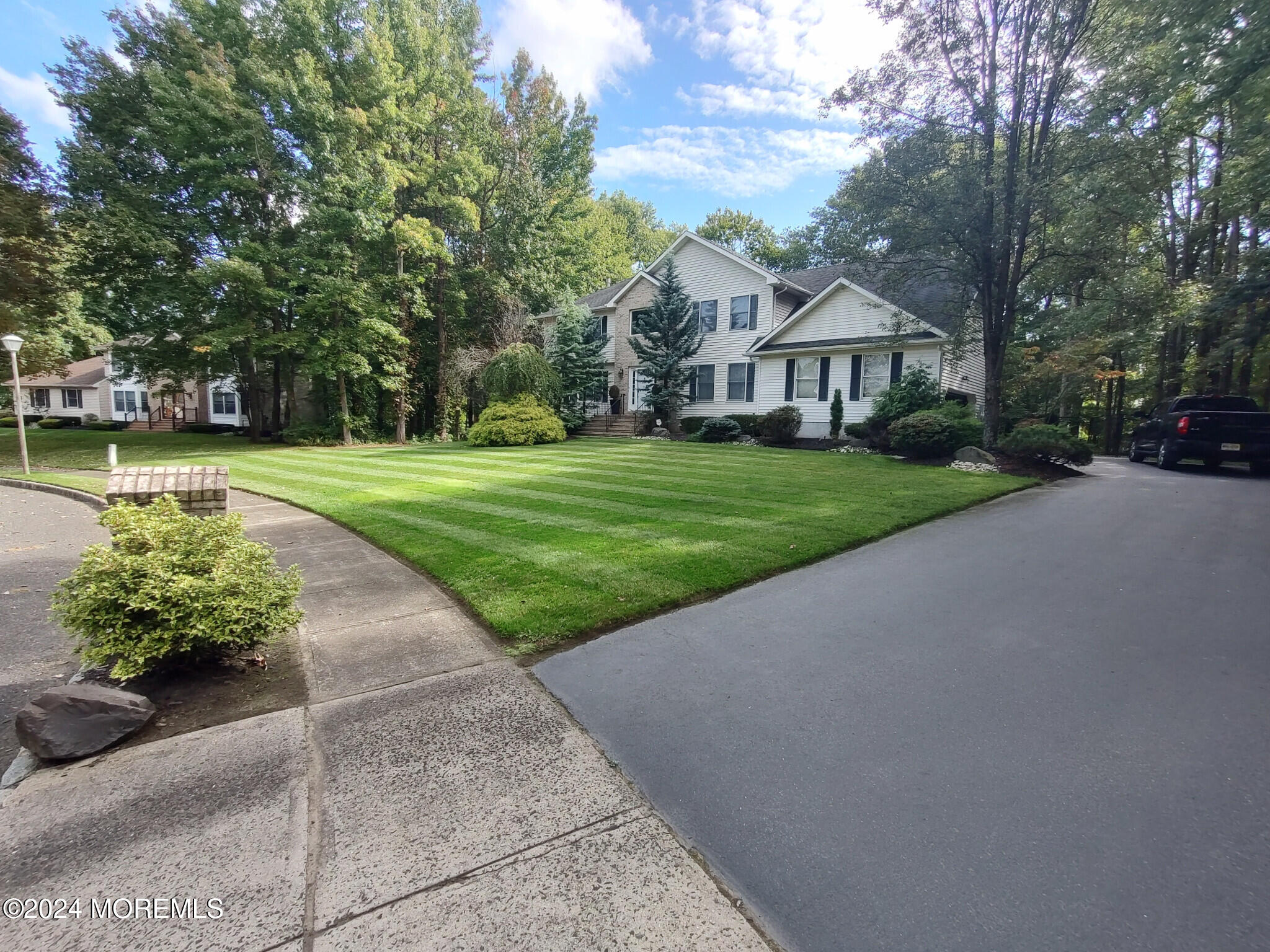 3 Guinevere Road Monroe Township, NJ 08831 - Photo 2 of 2 a front view of a house with garden
