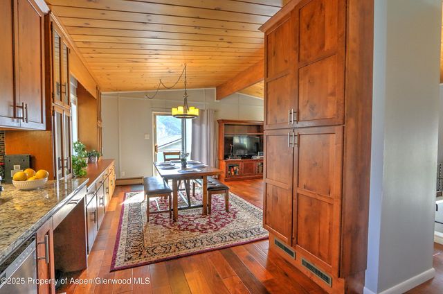 a view of a living room and dining room