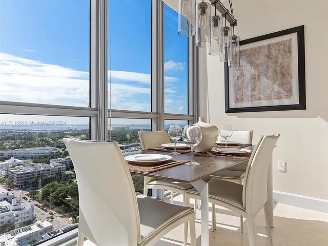 a kitchen with granite countertop a sink and a stove top oven