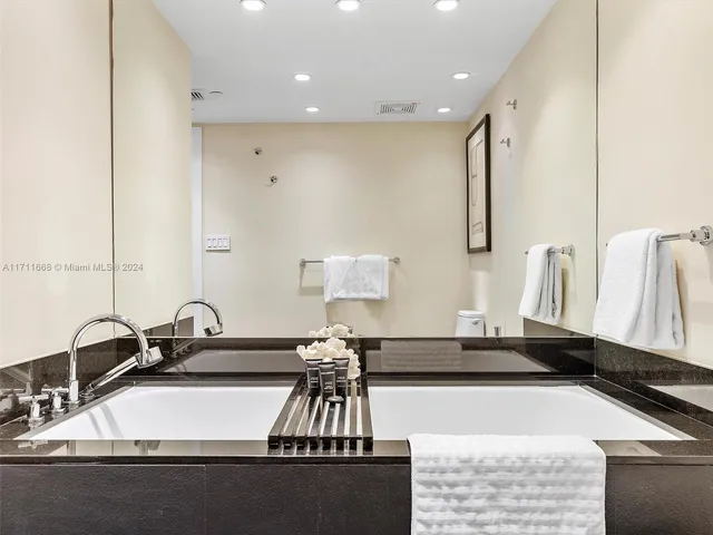 a kitchen that has a lot of cabinets in it