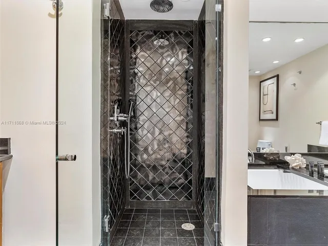 a bed room with a bed and a television