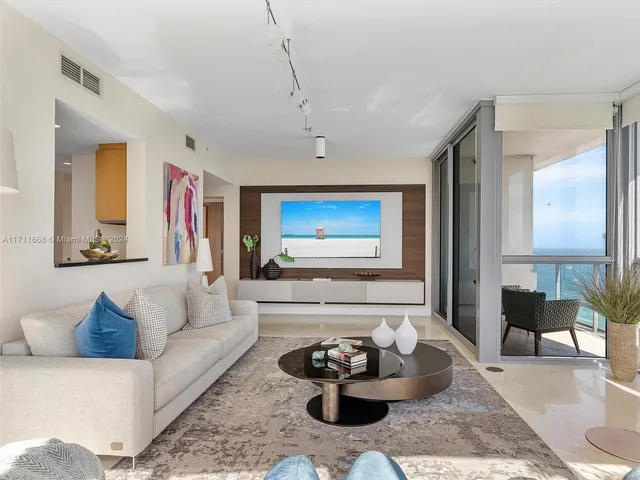 a room with furniture and a painting on the wall