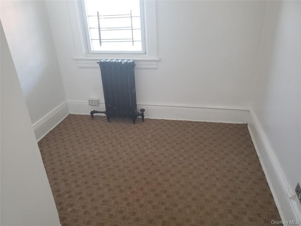 114 Lincoln Avenue, Unit 2 New Rochelle, NY 10801 - Photo 13 of 16 an empty room with a window