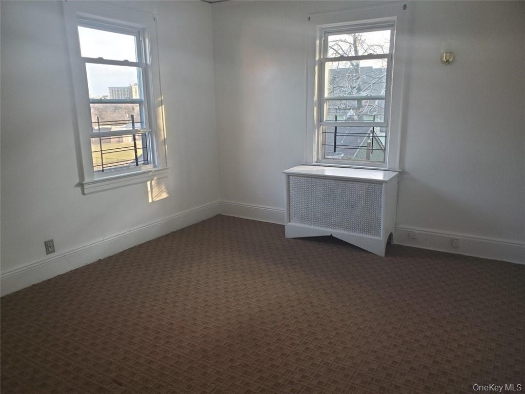 114 Lincoln Avenue, Unit 2 New Rochelle, NY 10801 - Photo 15 of 16 an empty room with windows