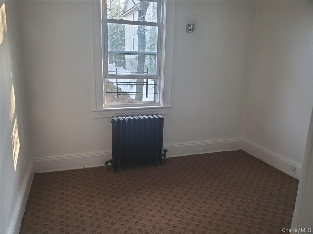 114 Lincoln Avenue, Unit 2 New Rochelle, NY 10801 - Photo 7 of 16 an empty room with a window