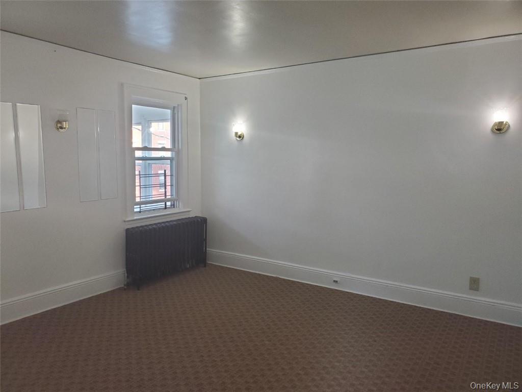 114 Lincoln Avenue, Unit 2 New Rochelle, NY 10801 - Photo 8 of 16 an empty room with windows