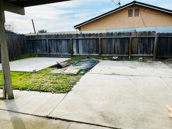 a view of a backyard with a small cabin