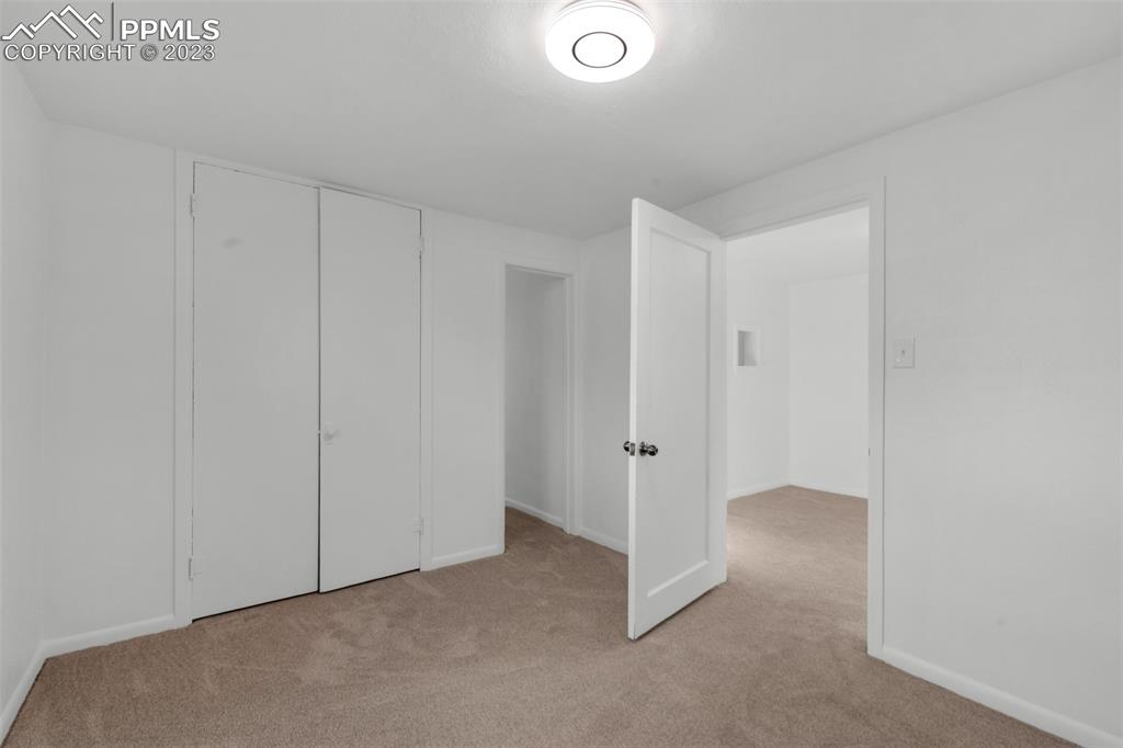 1007 Sunset Road Colorado Springs, CO 80909 - Photo 15 of 32 a view of an empty room