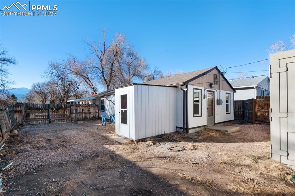 1007 Sunset Road Colorado Springs, CO 80909 - Photo 28 of 32 a view of a house with a snow in the yard