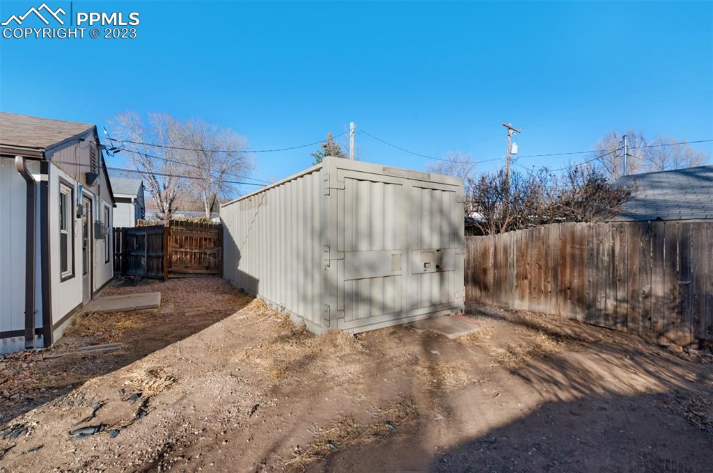 1007 Sunset Road Colorado Springs, CO 80909 - Photo 3 of 32 a view of a backyard