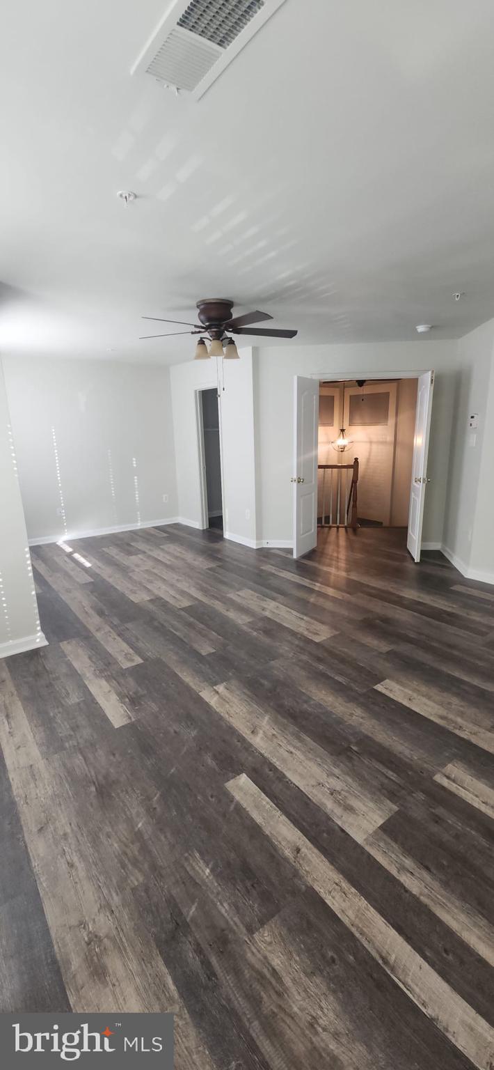 107 Swallow Pointe Court Frederick, MD 21702 - Photo 4 of 18 a view of a room with wooden floor