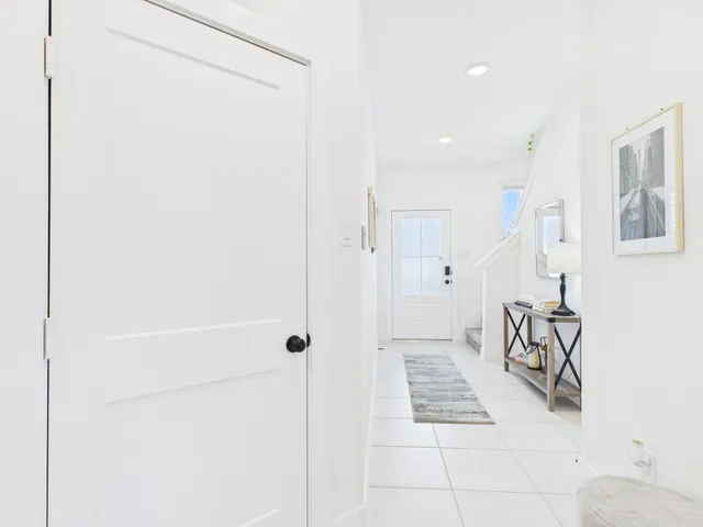 a bedroom with a bed and painting on the wall