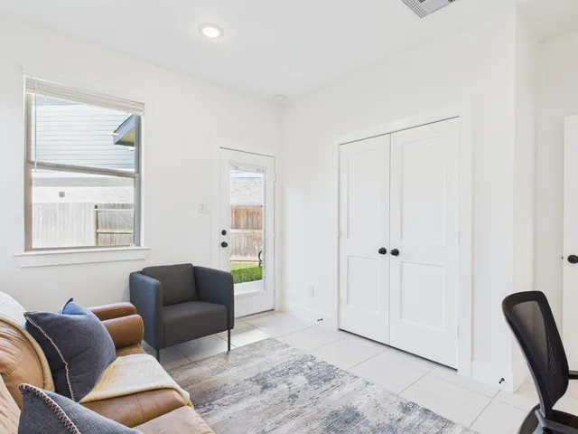 a bathroom with a sink a toilet and shower curtain