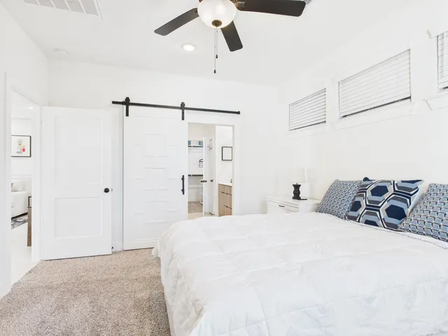 a bedroom with a bed and walk in closet