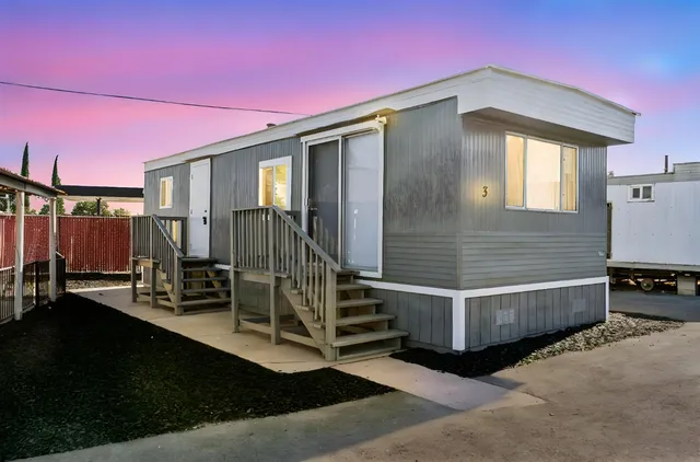 a front view of a house with a large window