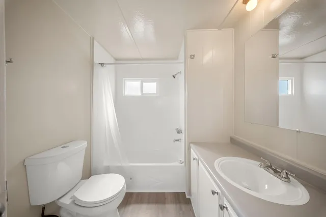 a bathroom with a toilet sink shower and bathtub