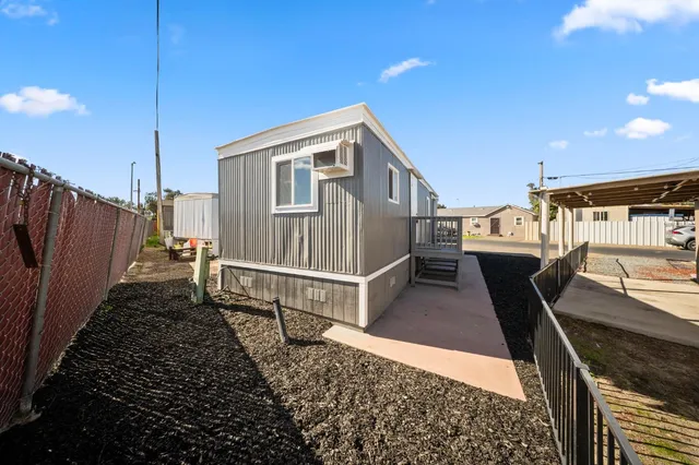 a view of a backyard with sitting area