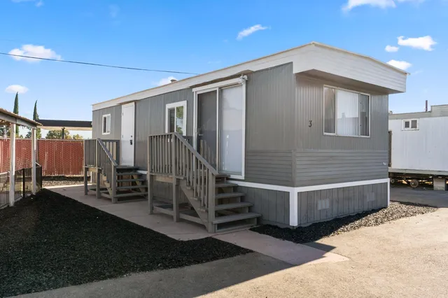 a front view of a house with stairs