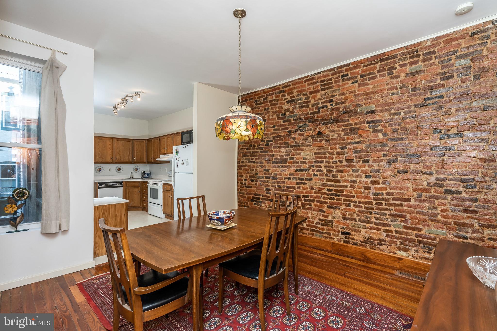 1047 Riverside Avenue Baltimore, MD 21230 - Photo 13 of 30 Exposed brick and wood floors.