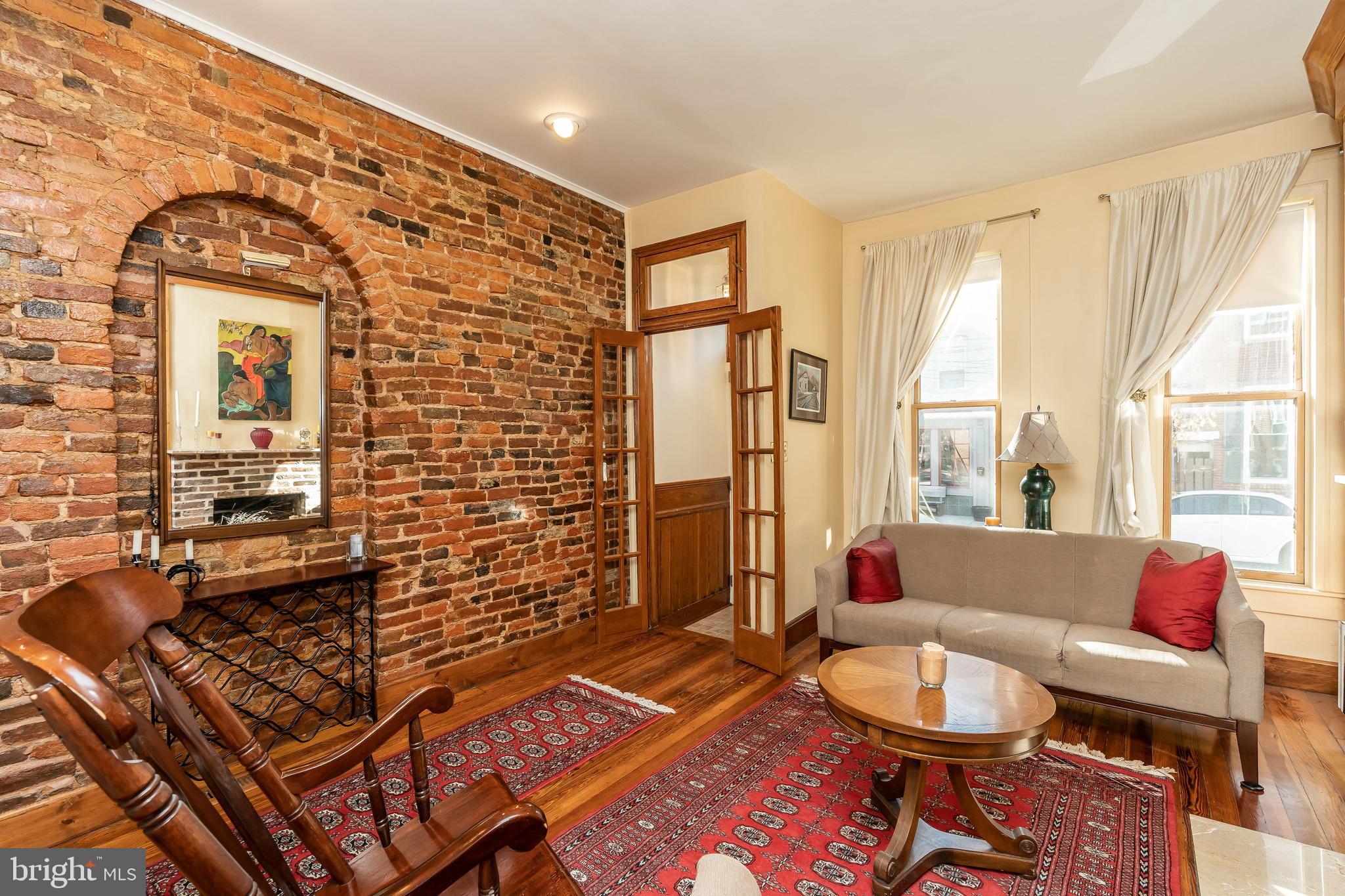 1047 Riverside Avenue Baltimore, MD 21230 - Photo 9 of 30 Exposed brick and gleaming wood floors.