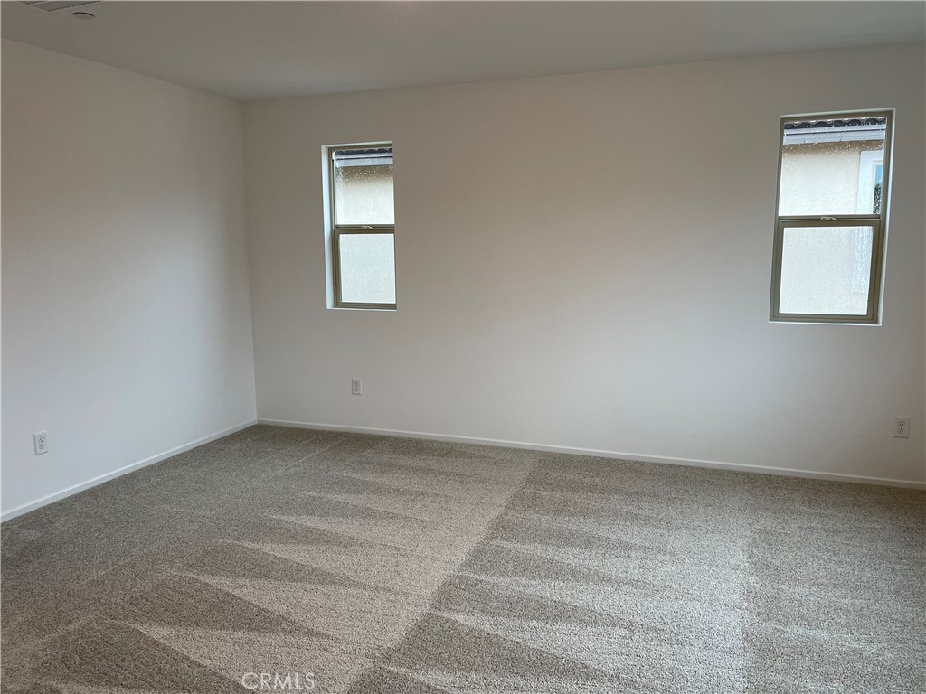 349 Lilly Street Rialto, CA 92376 - Photo 11 of 25 an empty room with a window