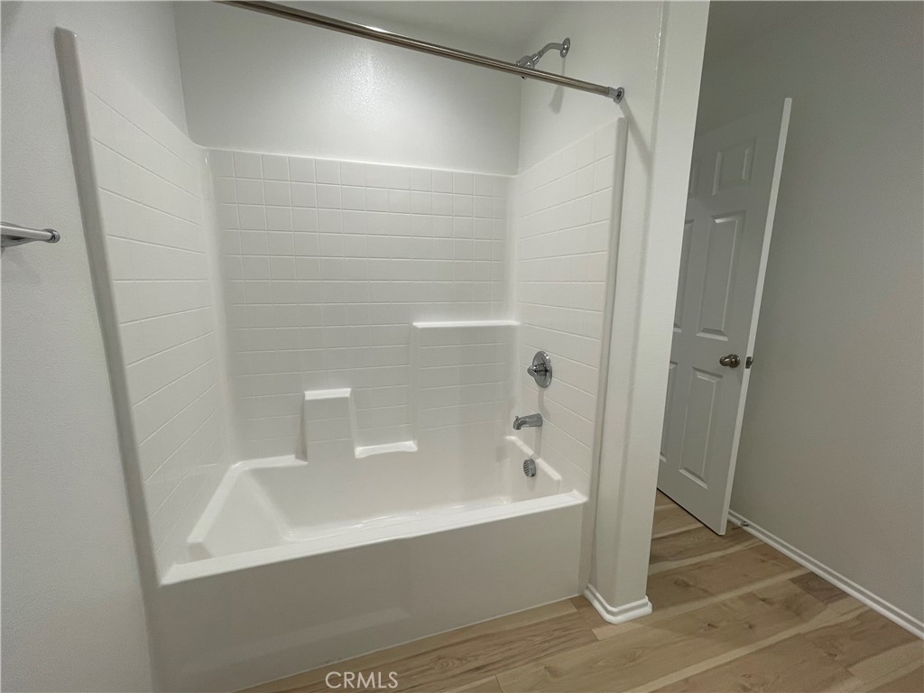 349 Lilly Street Rialto, CA 92376 - Photo 12 of 25 a bathroom with a bathtub and a shower