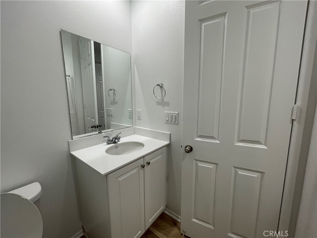 349 Lilly Street Rialto, CA 92376 - Photo 14 of 25 a bathroom with a sink and a mirror