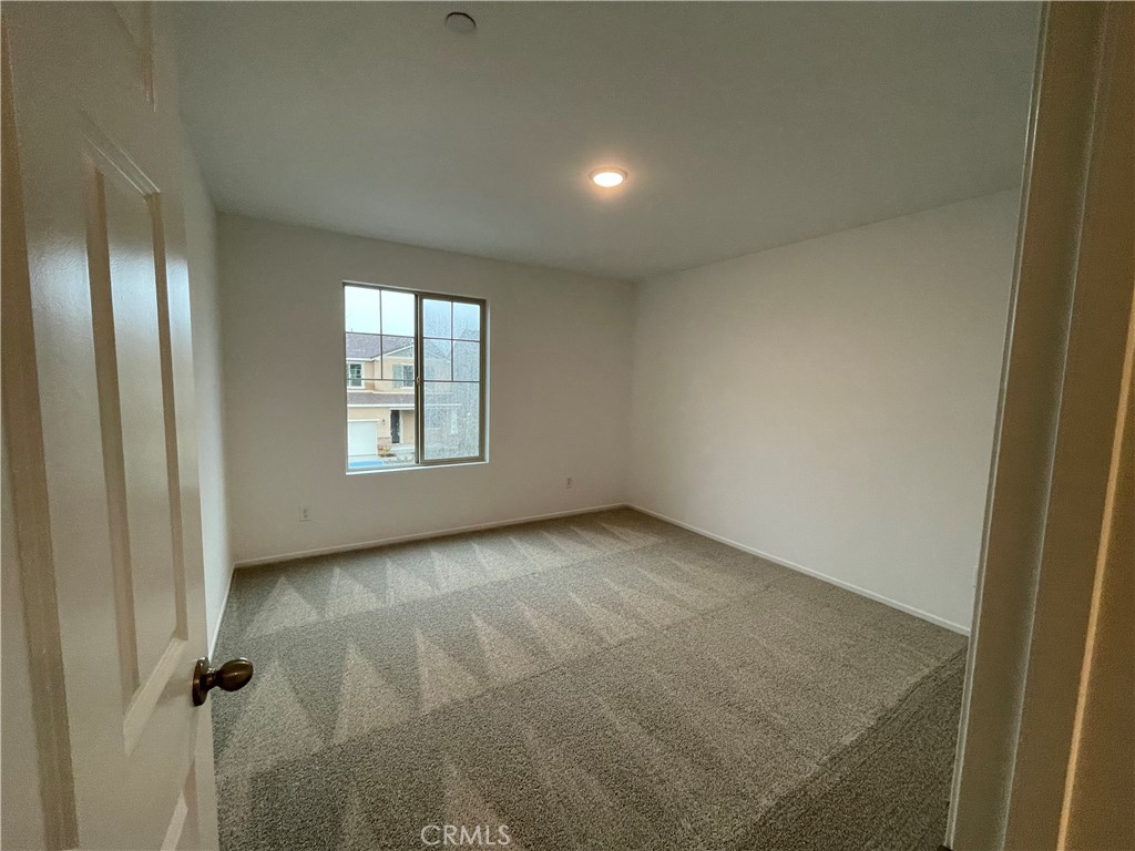 349 Lilly Street Rialto, CA 92376 - Photo 15 of 25 an empty room with windows