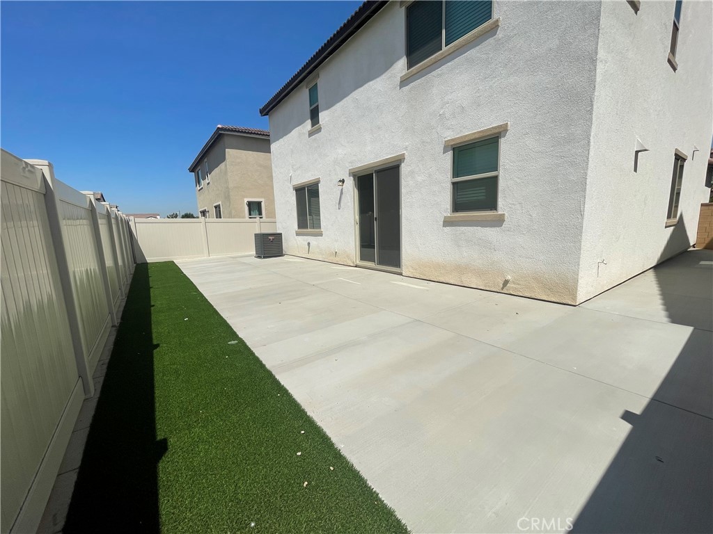 349 Lilly Street Rialto, CA 92376 - Photo 19 of 25 a view of a house with a backyard