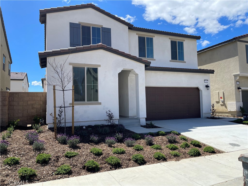 349 Lilly Street Rialto, CA 92376 - Photo 2 of 25 a front view of a house with a yard