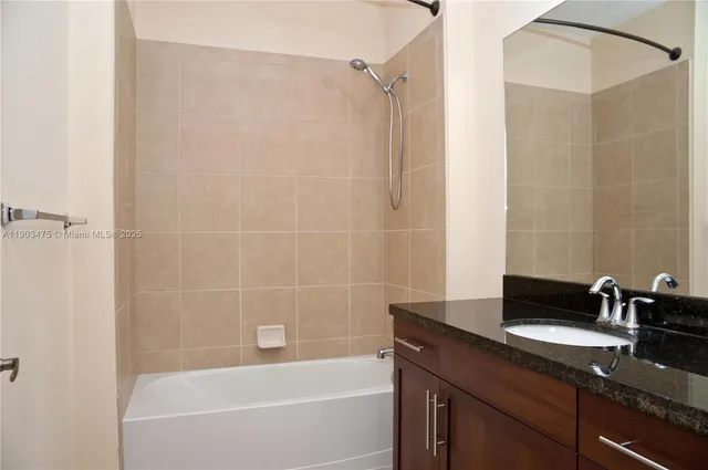 an empty room with wooden floor and a window