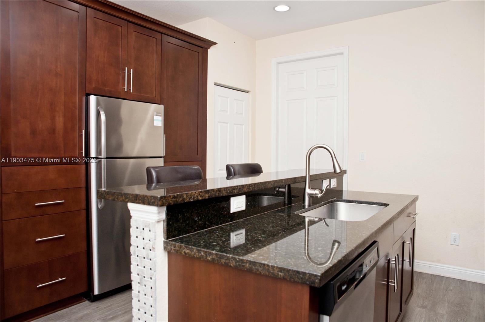 14620 Southwest 15th Street Pembroke Pines, FL 33027 - Photo 19 of 59 a kitchen with granite countertop a sink and cabinets