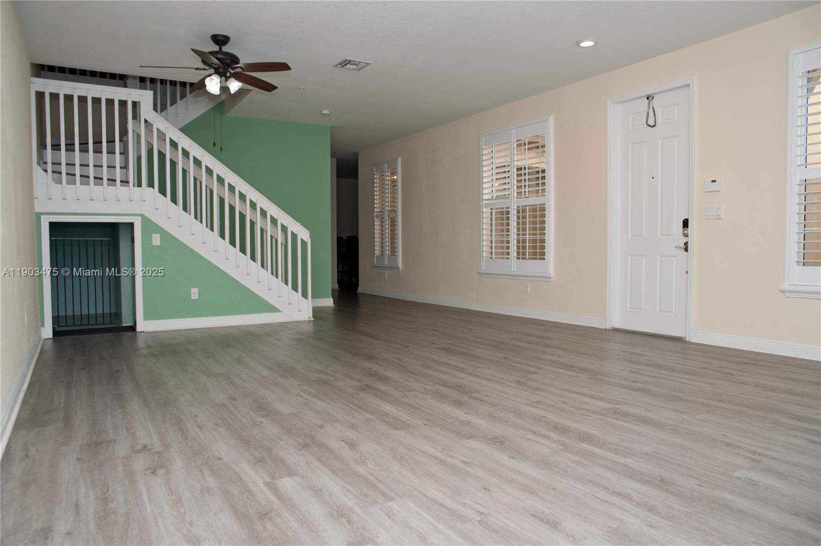 14620 Southwest 15th Street Pembroke Pines, FL 33027 - Photo 24 of 59 a view of a hallway with wooden floor and entryway