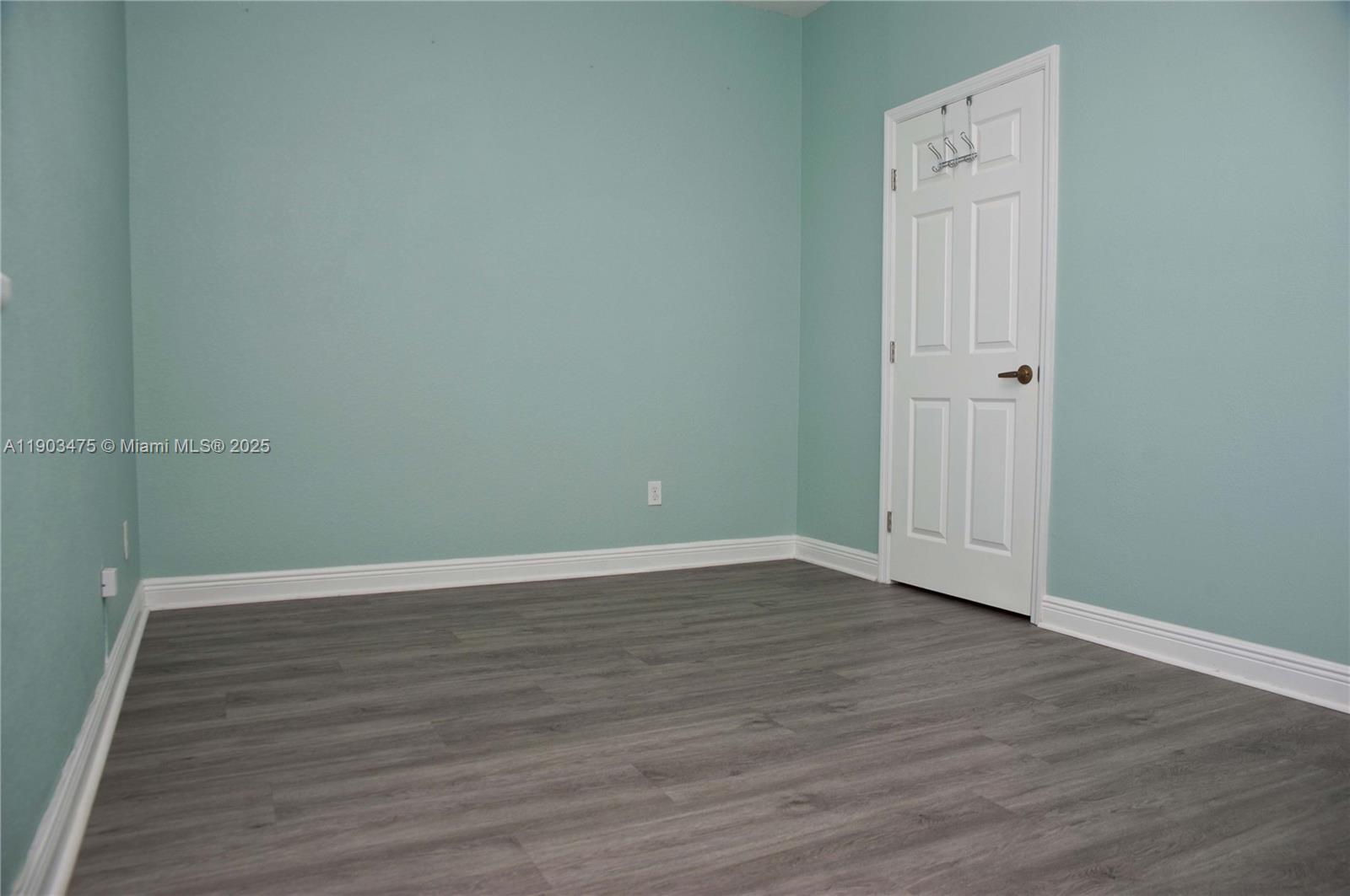 14620 Southwest 15th Street Pembroke Pines, FL 33027 - Photo 28 of 59 a view of an empty room with wooden floor