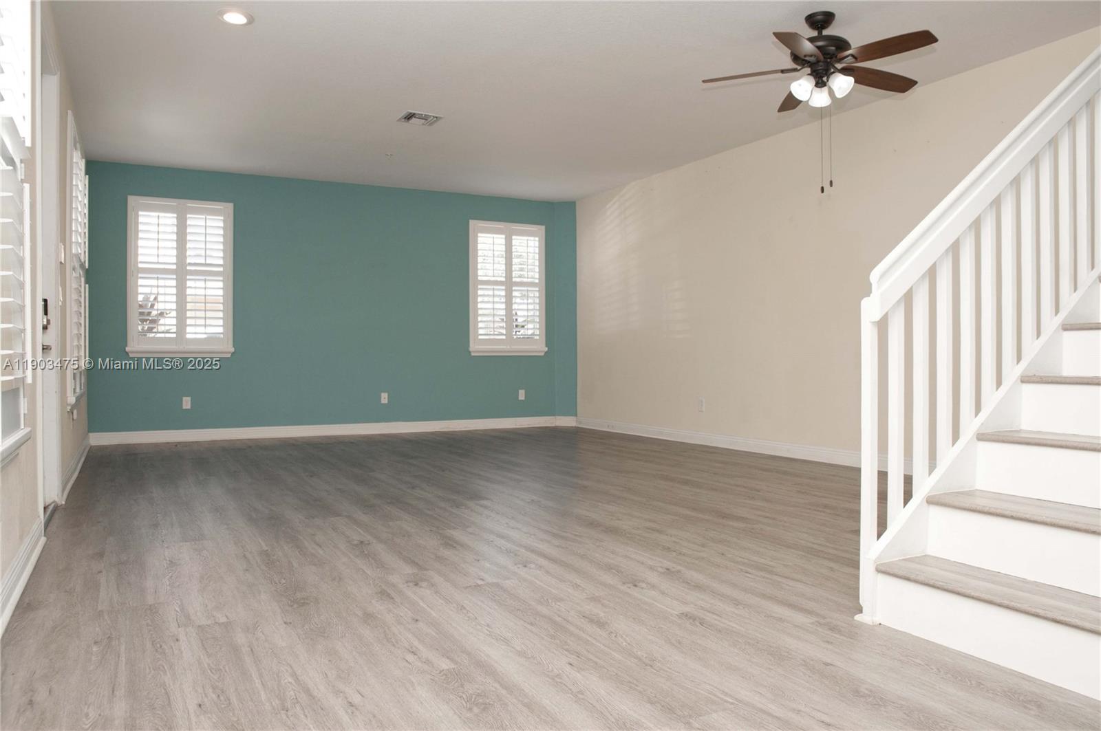 14620 Southwest 15th Street Pembroke Pines, FL 33027 - Photo 3 of 59 a view of an empty room with a window and wooden floor