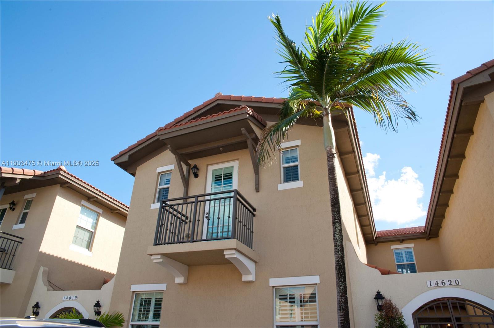 14620 Southwest 15th Street Pembroke Pines, FL 33027 - Photo 48 of 59 a view of a house with a palm tree
