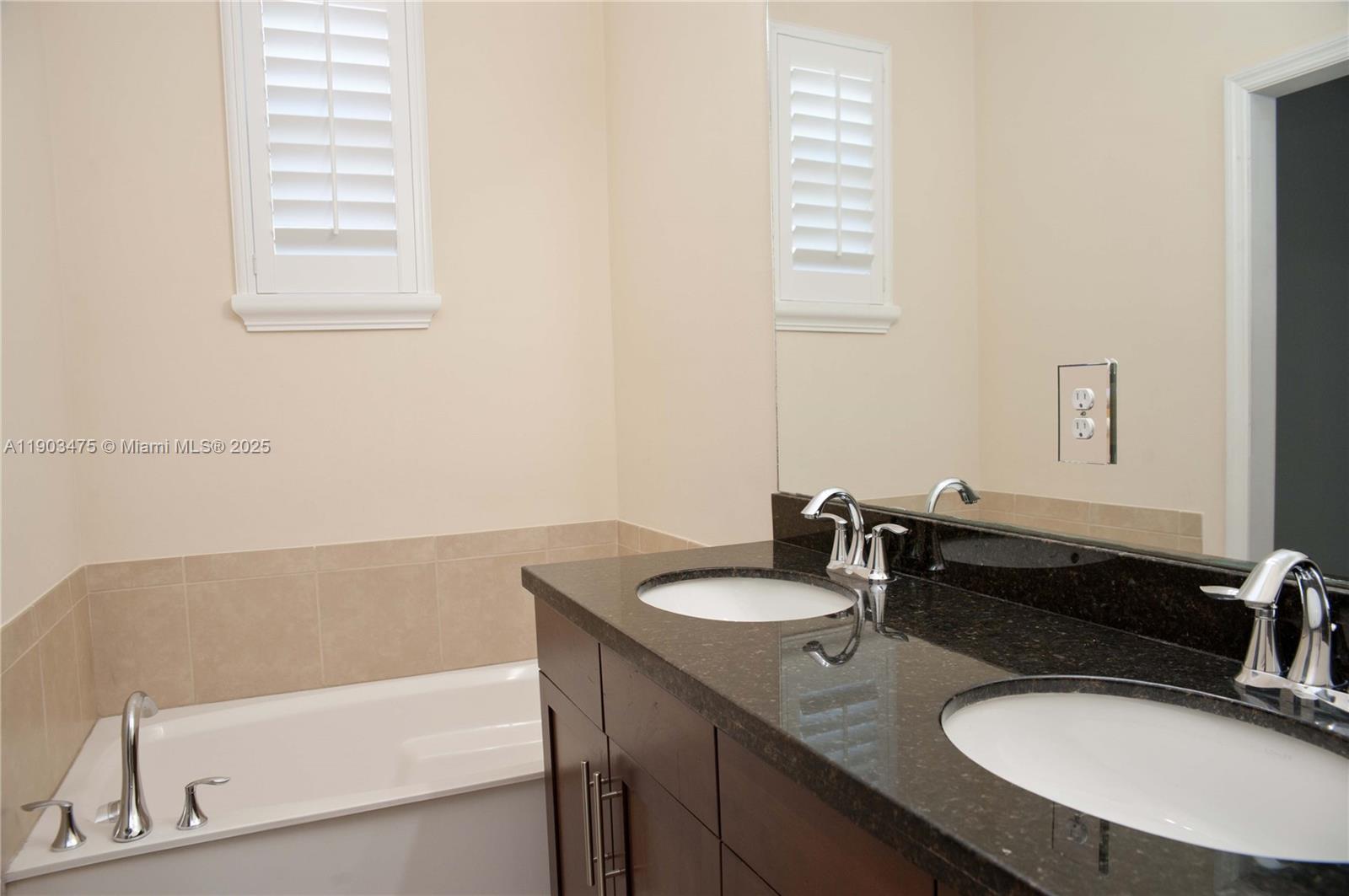 14620 Southwest 15th Street Pembroke Pines, FL 33027 - Photo 6 of 59 a bathroom with a sink and a bathtub