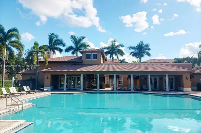 a bathroom with a granite countertop bathtub shower sink vanity and a mirror