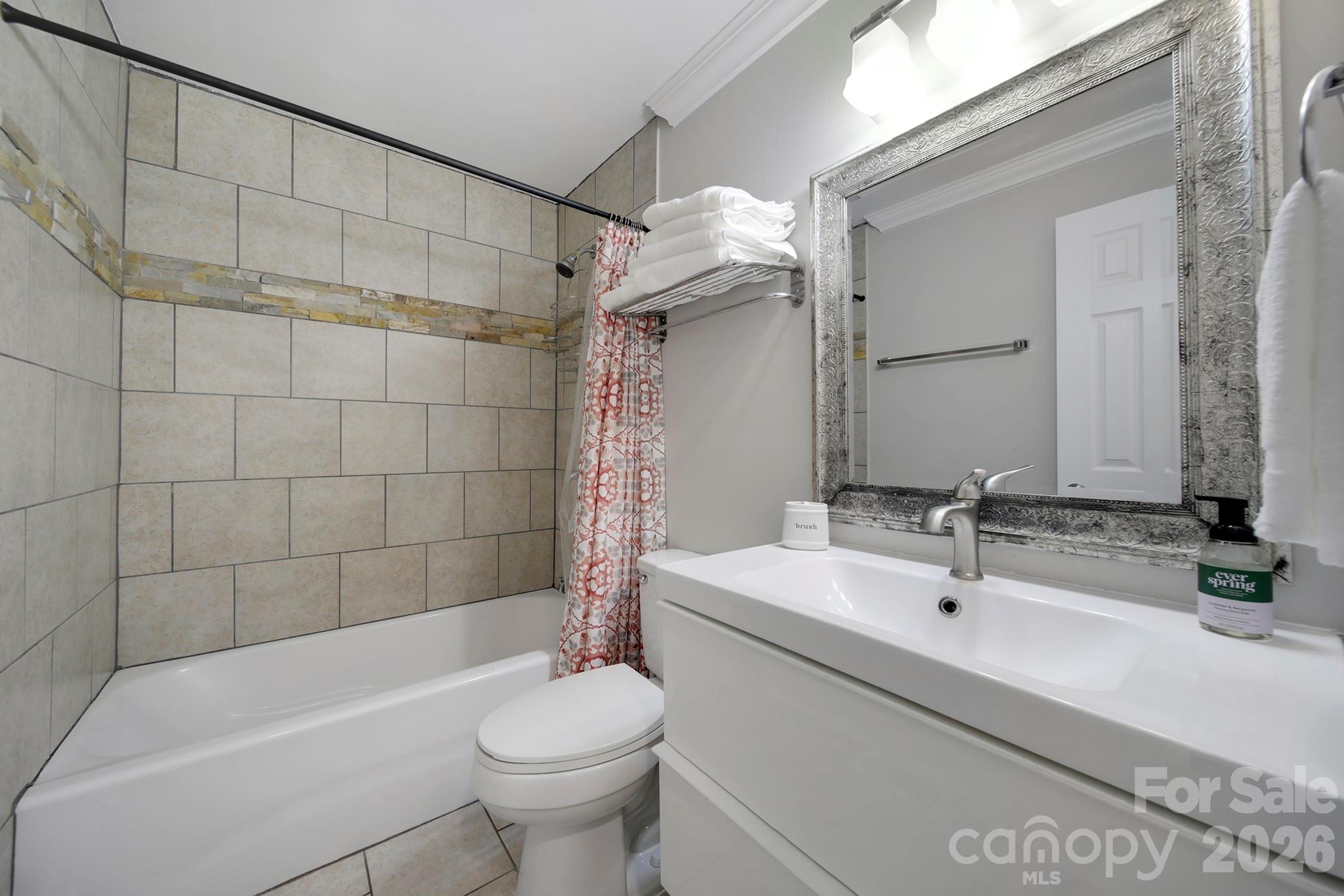100 Privette Street Fort Mill, SC 29715 - Photo 13 of 25 a bathroom with a sink a toilet and bathtub