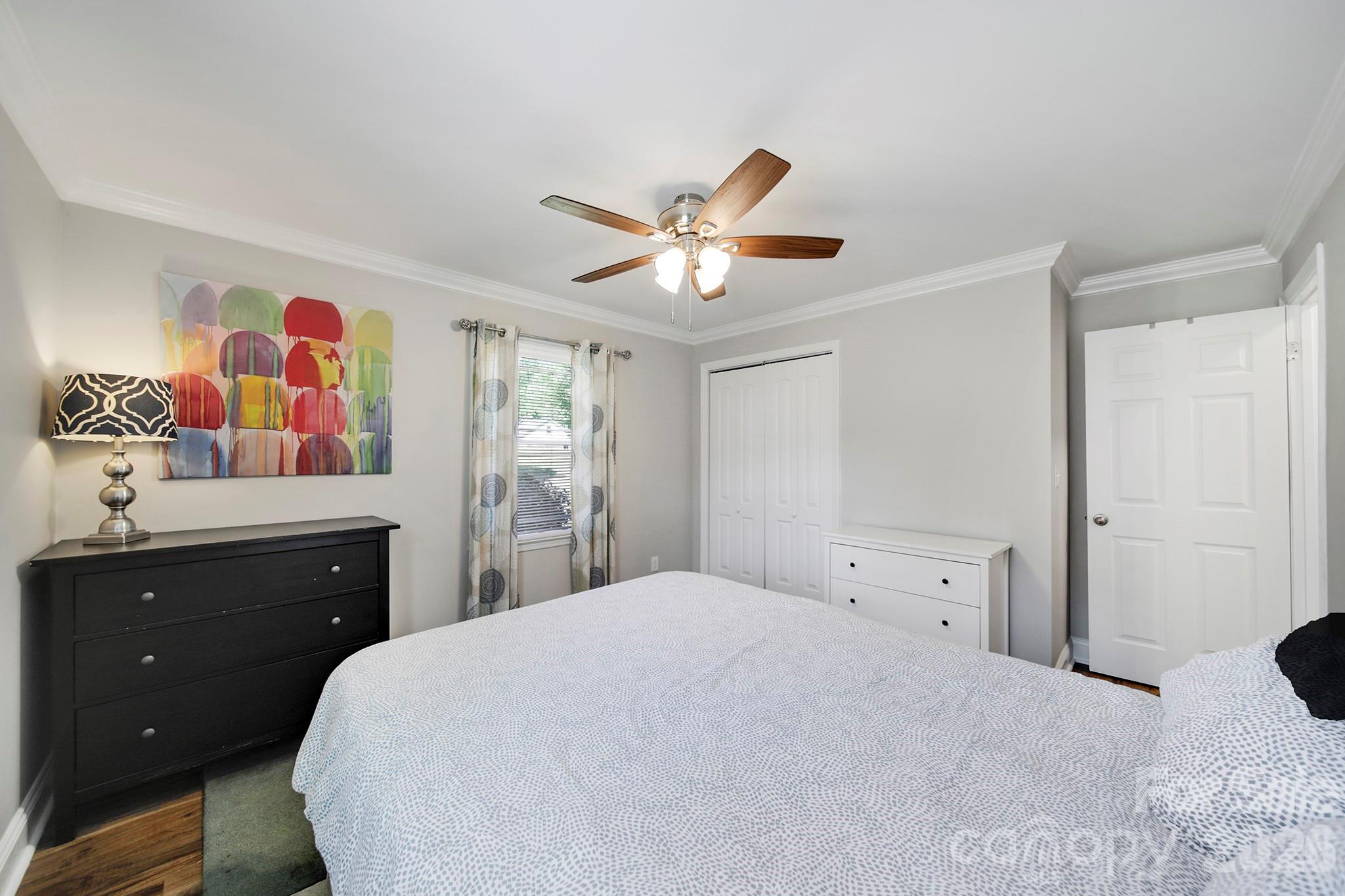 100 Privette Street Fort Mill, SC 29715 - Photo 15 of 25 a bedroom with a bed and a dresser