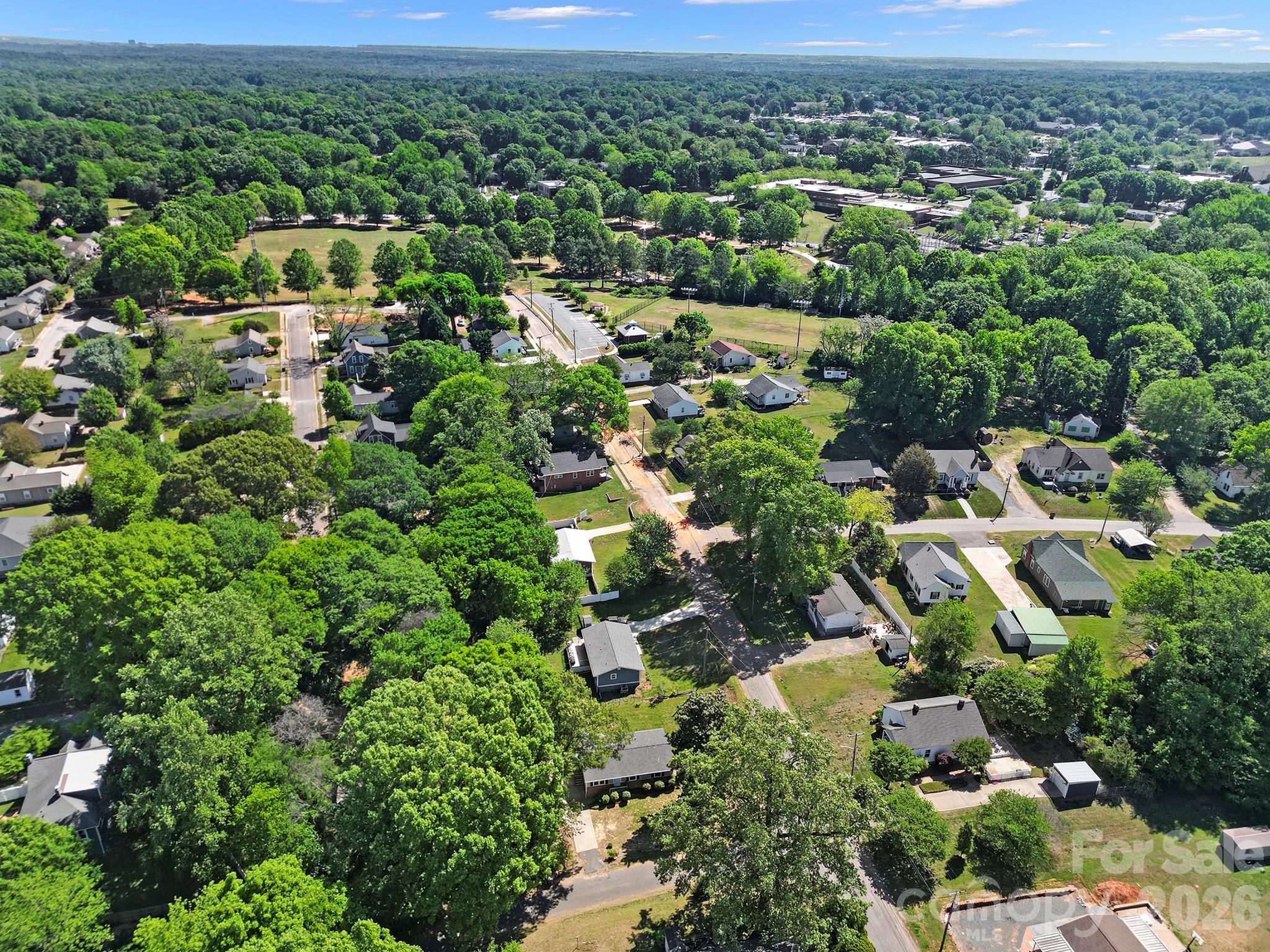 100 Privette Street Fort Mill, SC 29715 - Photo 2 of 25 an aerial view of residential houses with outdoor space and trees