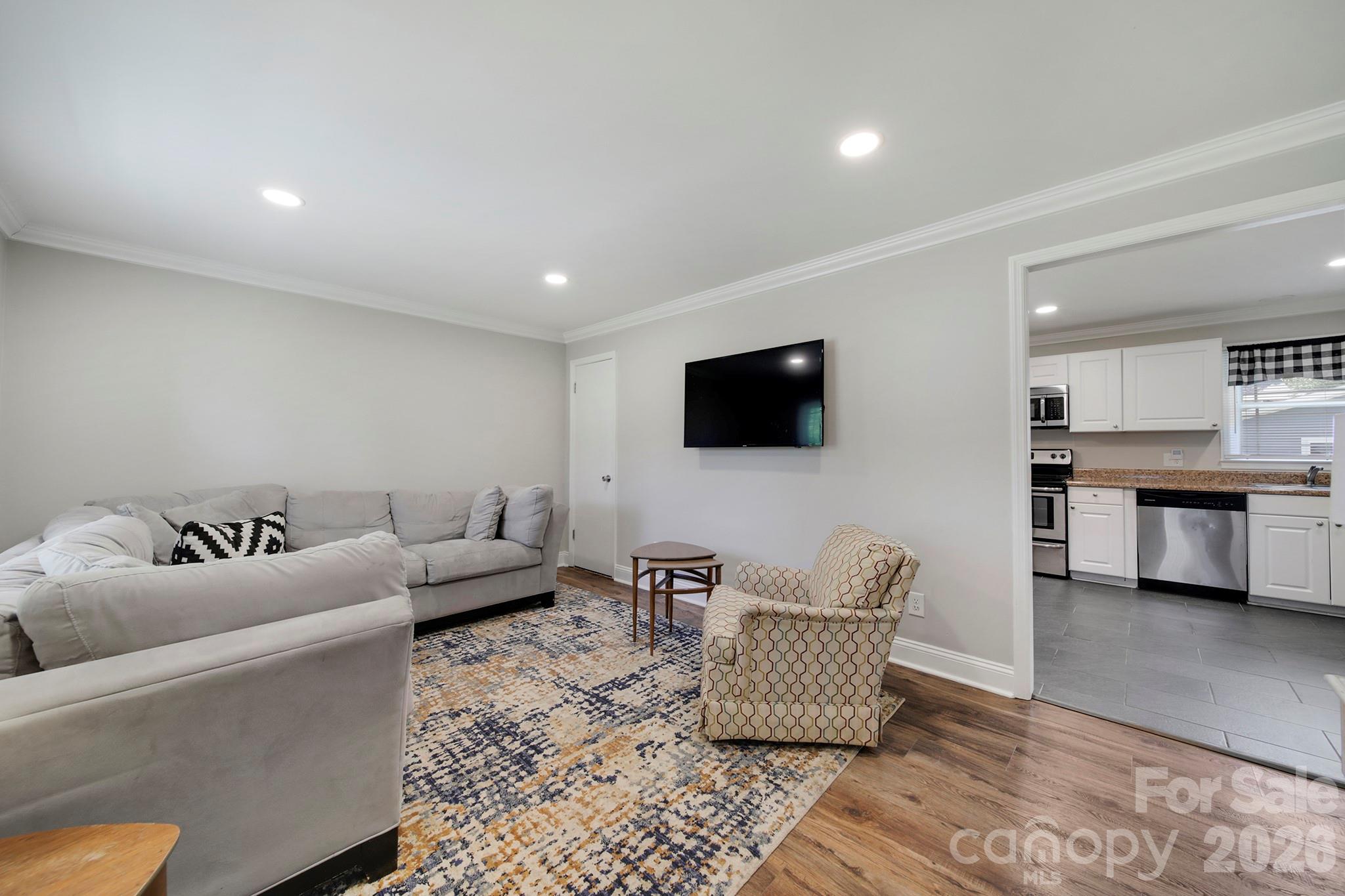 100 Privette Street Fort Mill, SC 29715 - Photo 5 of 25 a living room with furniture and a flat screen tv
