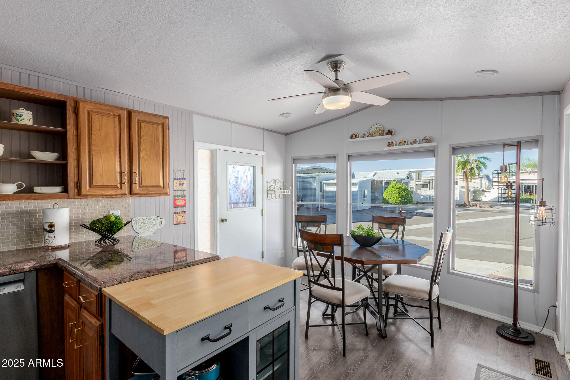 17200 West Bell Road, Unit 1233 Surprise, AZ 85374 - Photo 11 of 41 a view of a dining room with furniture and a chandelier