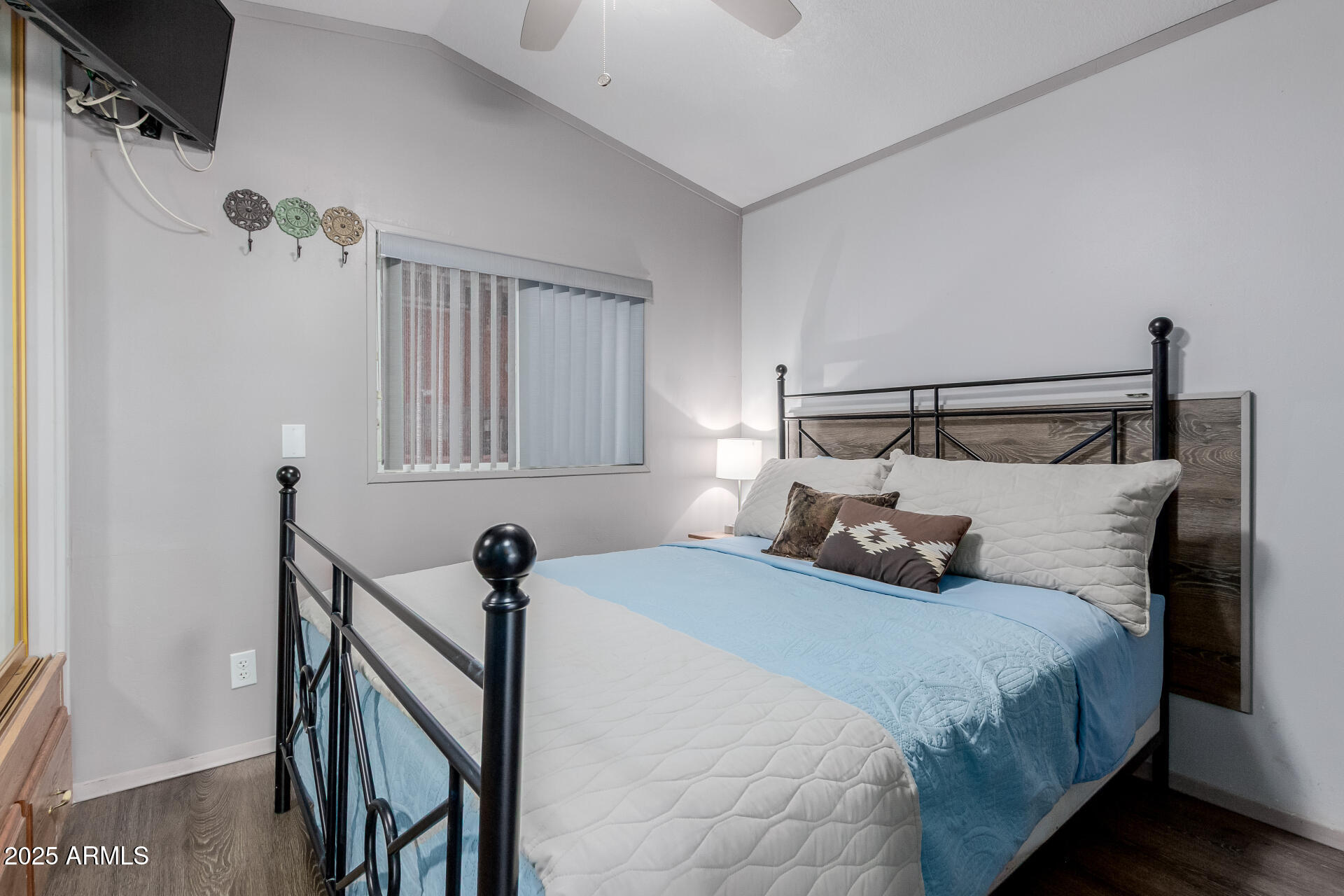 17200 West Bell Road, Unit 1233 Surprise, AZ 85374 - Photo 15 of 41 a bedroom with bed and a window