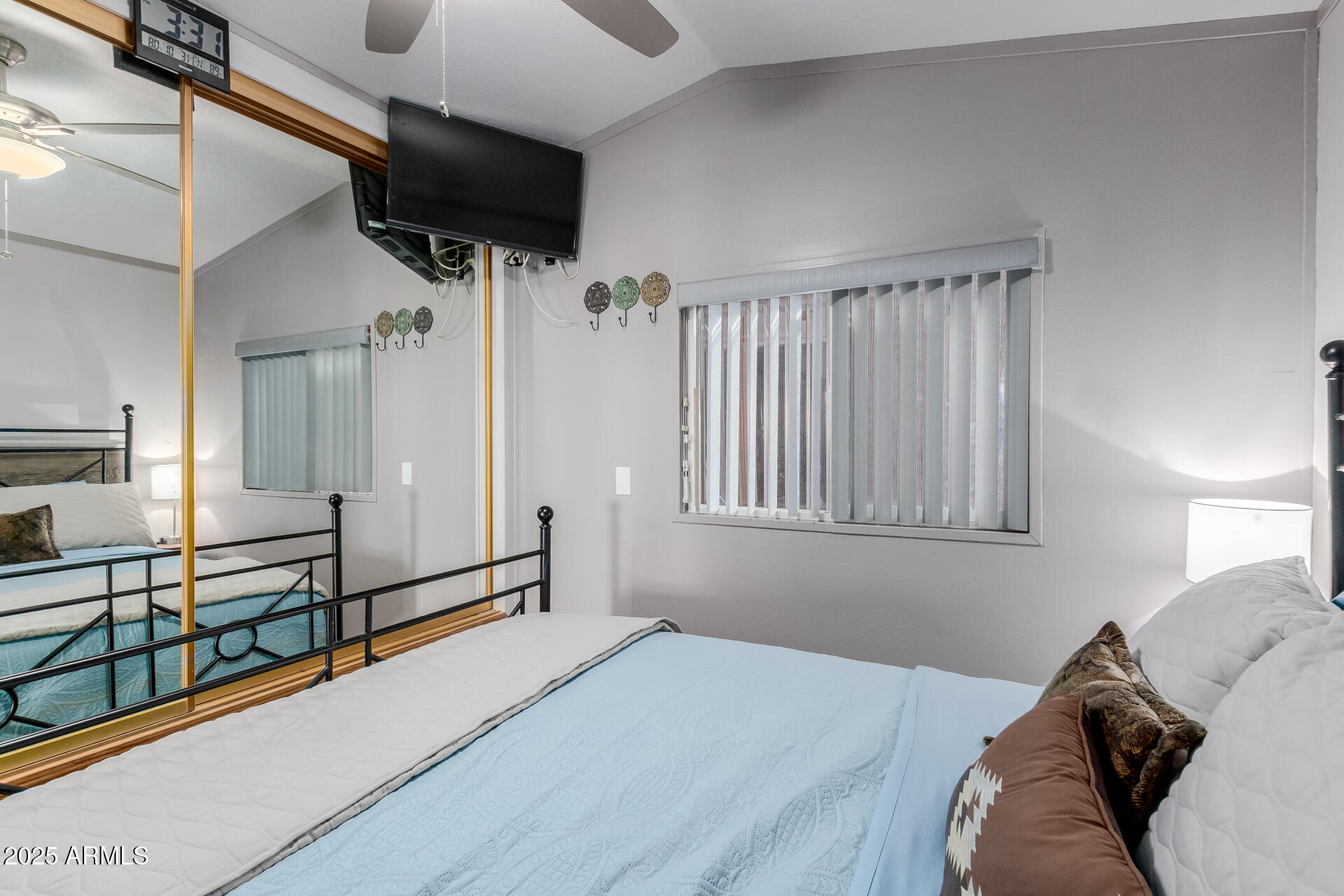 17200 West Bell Road, Unit 1233 Surprise, AZ 85374 - Photo 17 of 41 a bed room with a bed and a television